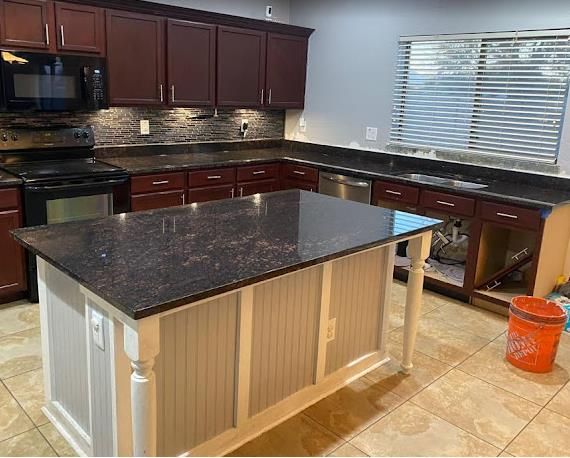 Tan Brown granite kitchen install with cherry cabinets by AZ Elite Granite