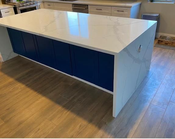 Calacatta quartz waterfall edge island by AZ Elite Granite